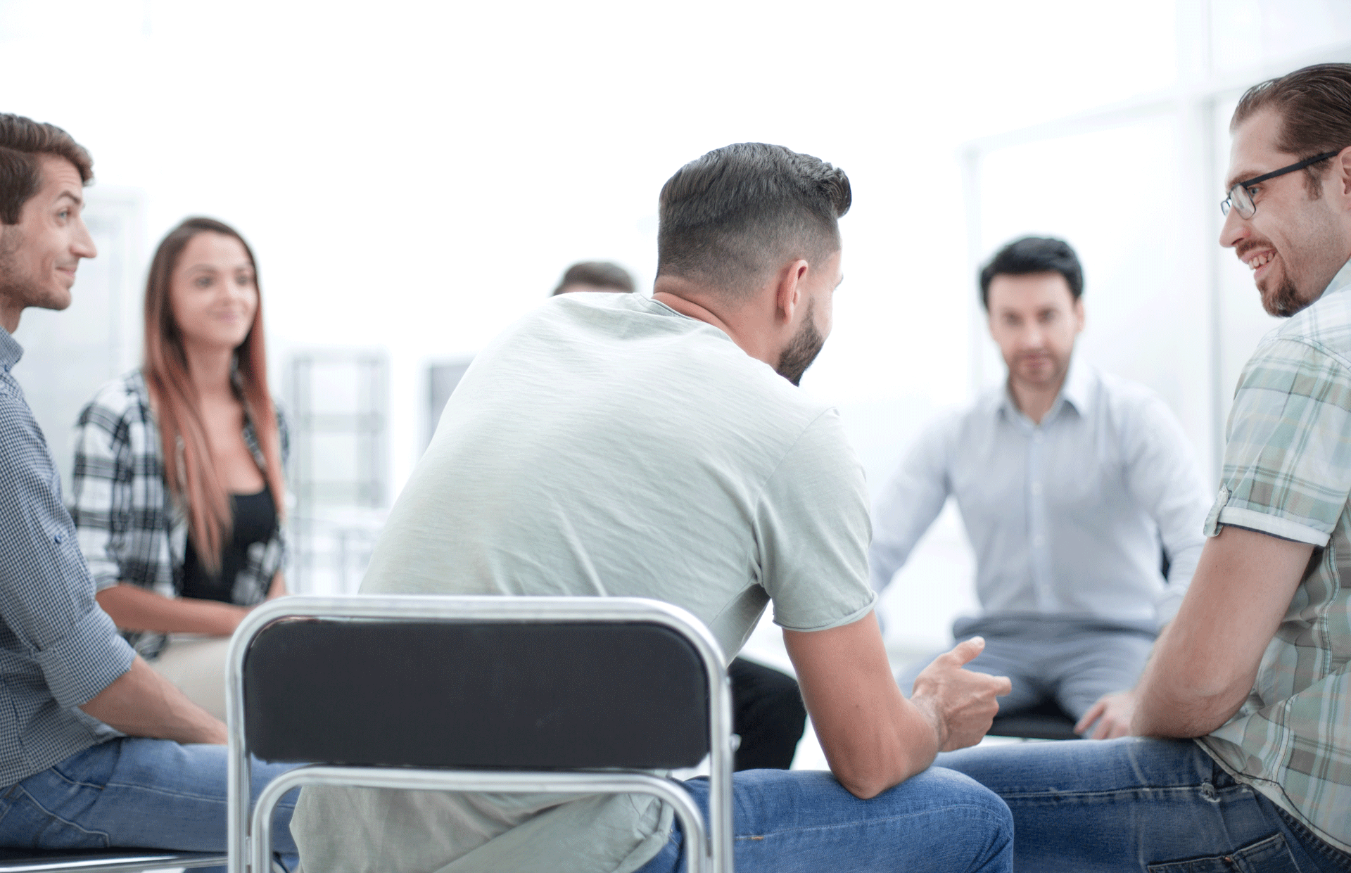 Group engaging in Cognitive Behavioral Therapy (CBT) session, sitting in circle for discussion Group engaging in Cognitive Behavioral Therapy (CBT) session, sitting in circle for discussion