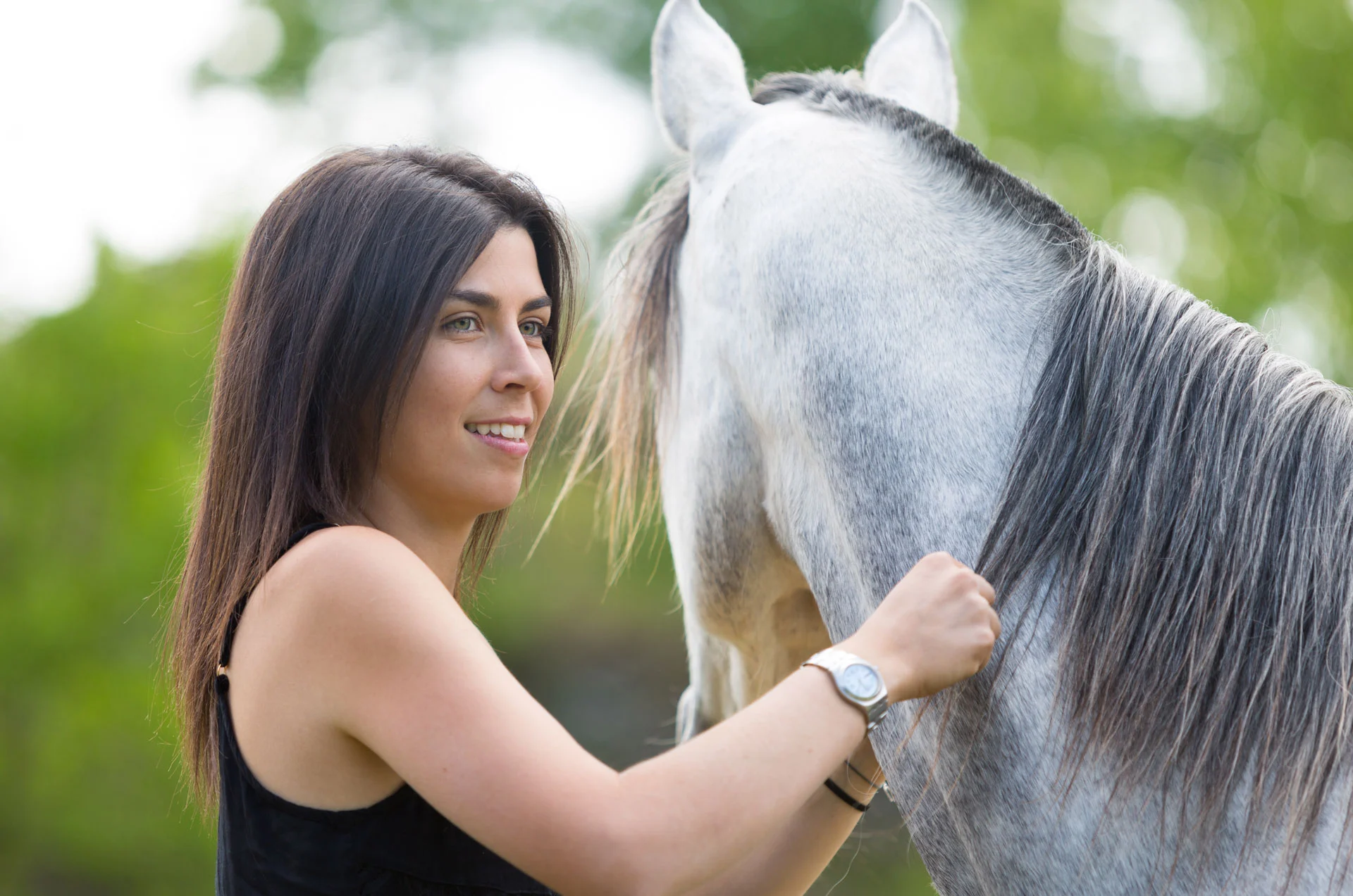 Woman Smiling While Grooming A Horse, Potentially Part Of An Equine-Assisted Therapy Program woman smiling while grooming a horse, potentially part of an equine-assisted therapy program