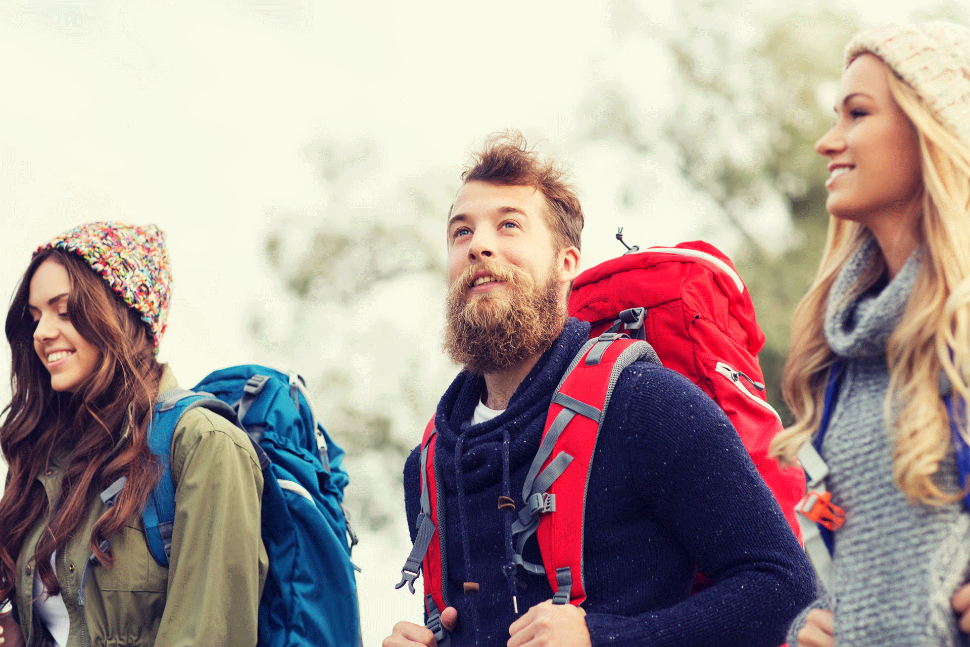 Three friends hiking together, enjoying nature illustrating the benefits of integrated treatment for dual diagnosis Three friends hiking together, enjoying nature illustrating the benefits of integrated treatment for dual diagnosis