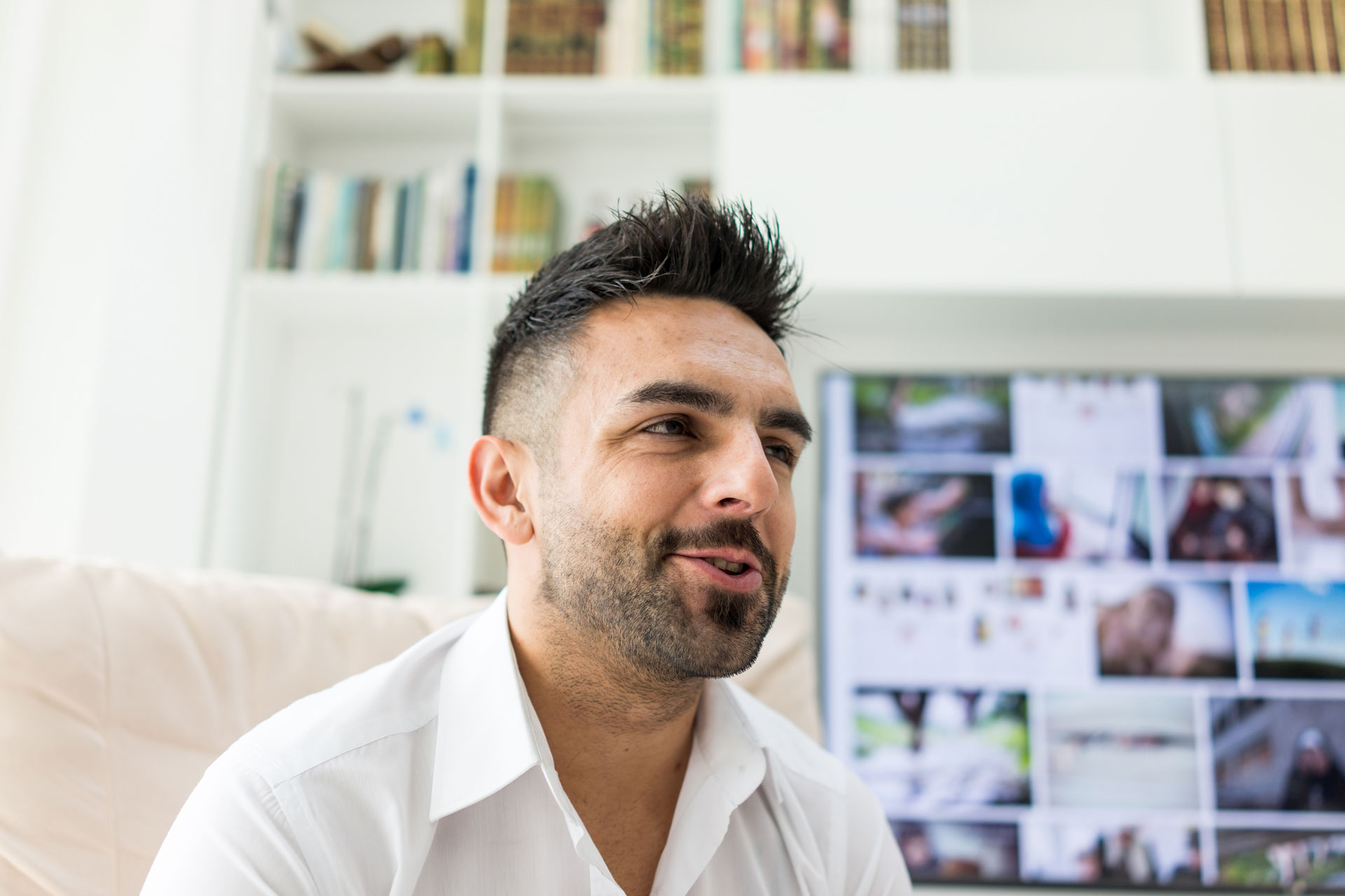 Man in a white shirt appears reflective, hinting at contemplation on substance recovery.
