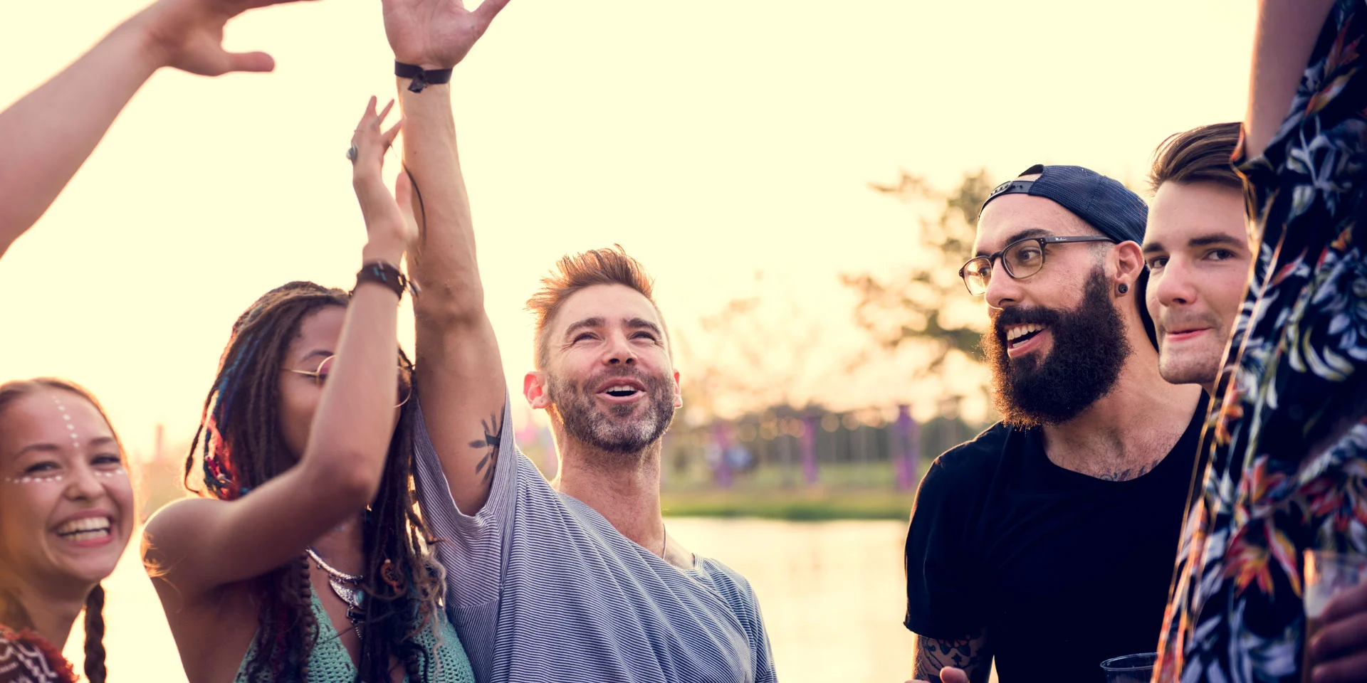  joyful group of friends high-fiving, celebrating life, potentially after a recovery milestone