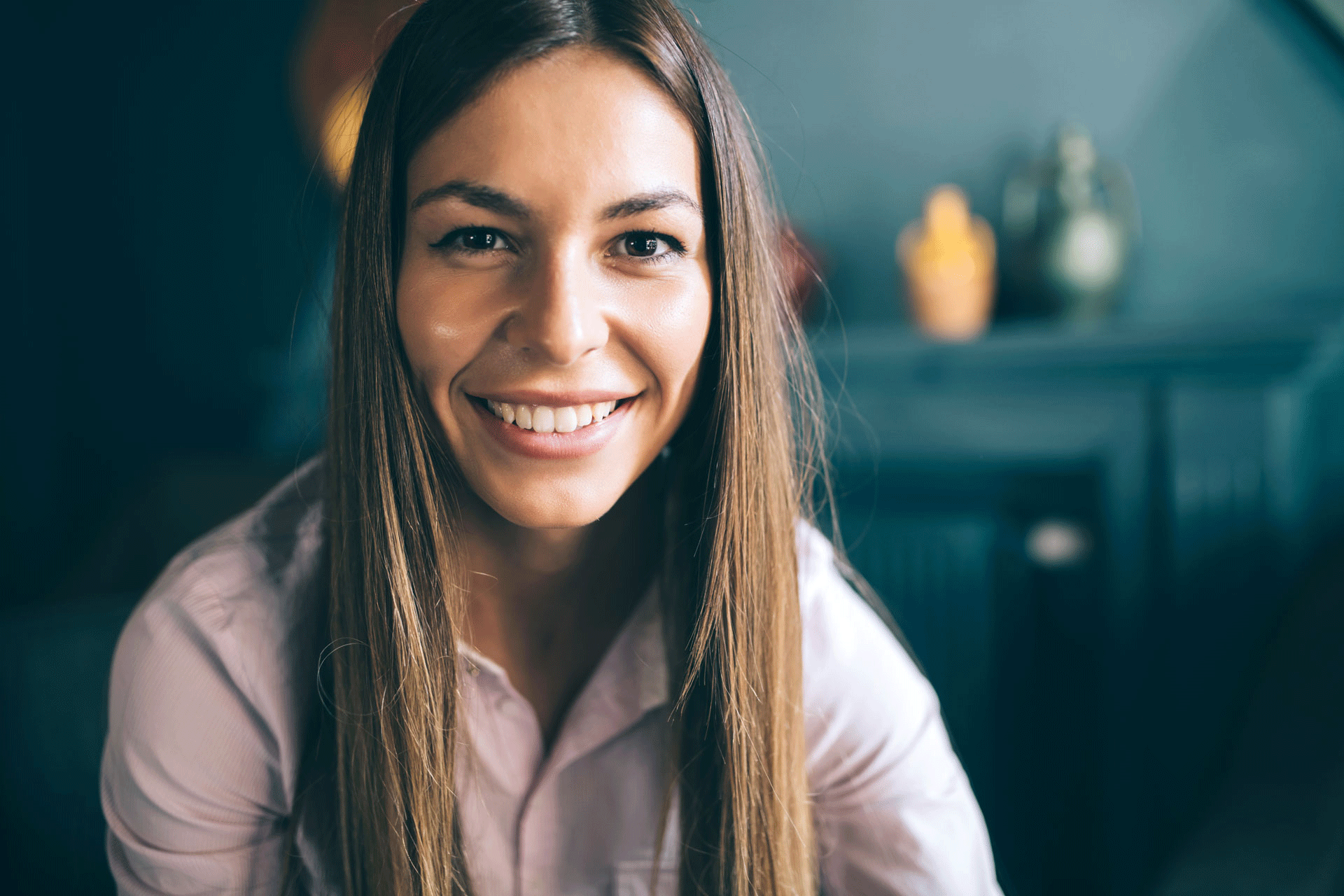 smiling woman exemplifying emotional well-being and positivity