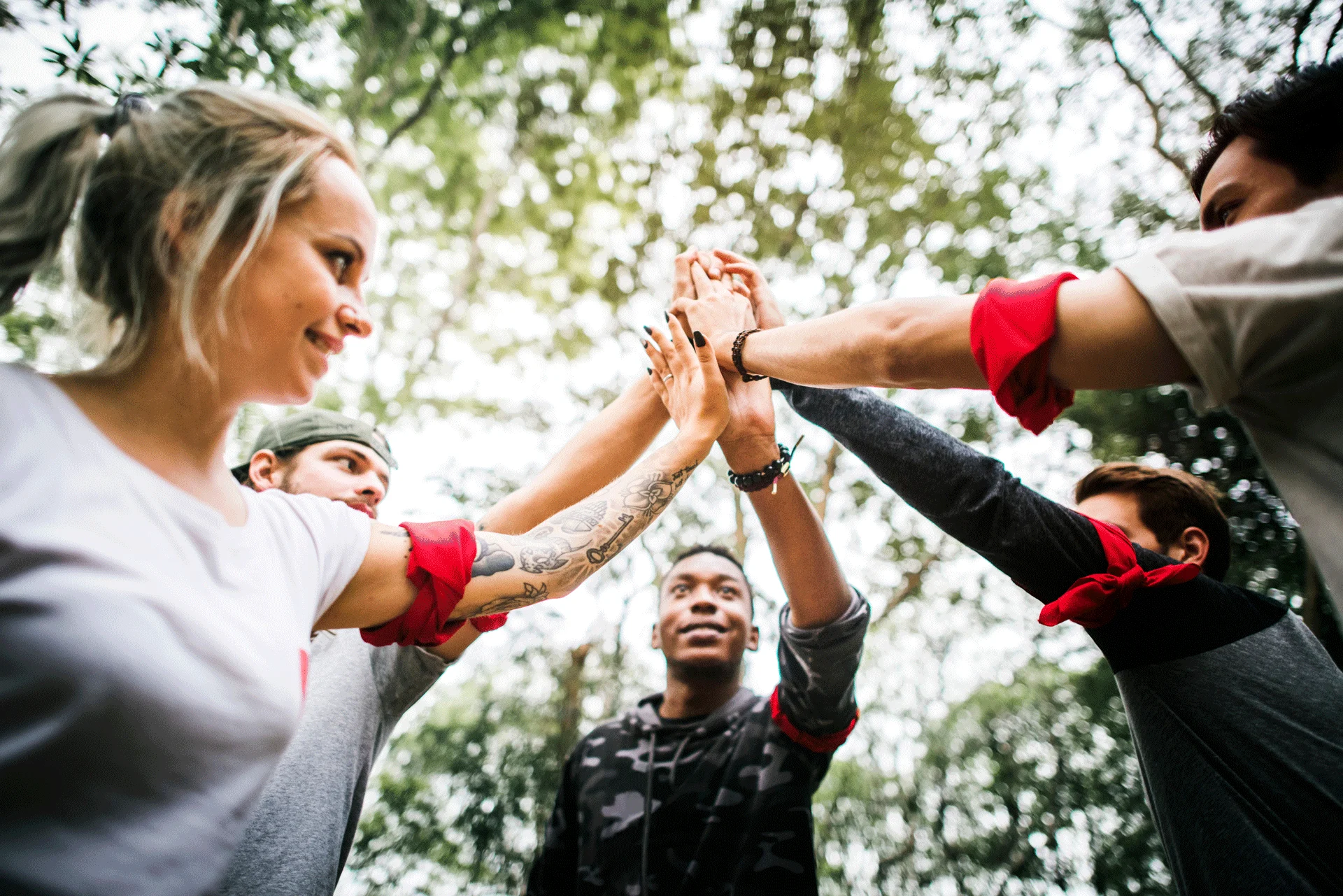 diverse group of people joining hands in a show of unity and support reflecting the community aspect of substance abuse and mental health services
