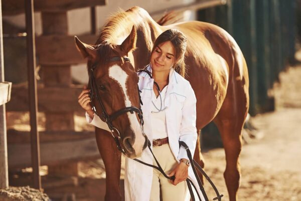 A woman engaged in equine-assisted psychotherapy