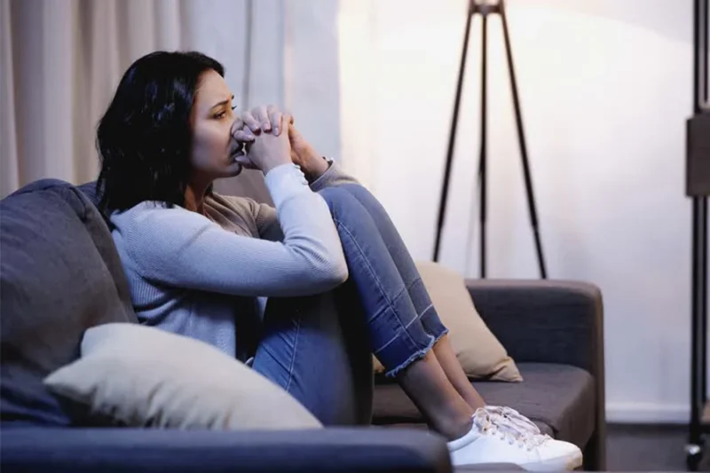 an image of a woman showing negative emotions and other trauma symptoms.