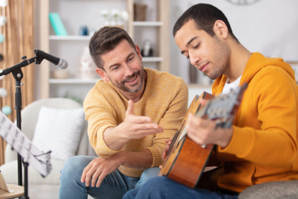Certified music therapist leading a music therapy session in a calming environment with various instruments, supporting emotional healing and addiction recovery at Big Sky Treatment