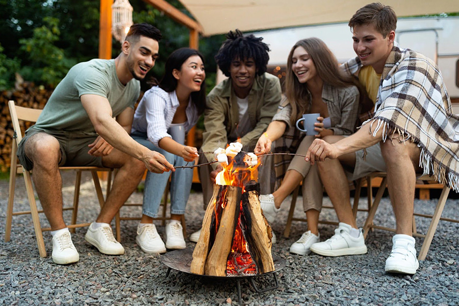 Diverse Friends Roast Marshmallows Over A Campfire As Part Of An Effective Treatment For Opioid Addiction diverse friends roast marshmallows over a campfire as part of an effective treatment for opioid addiction