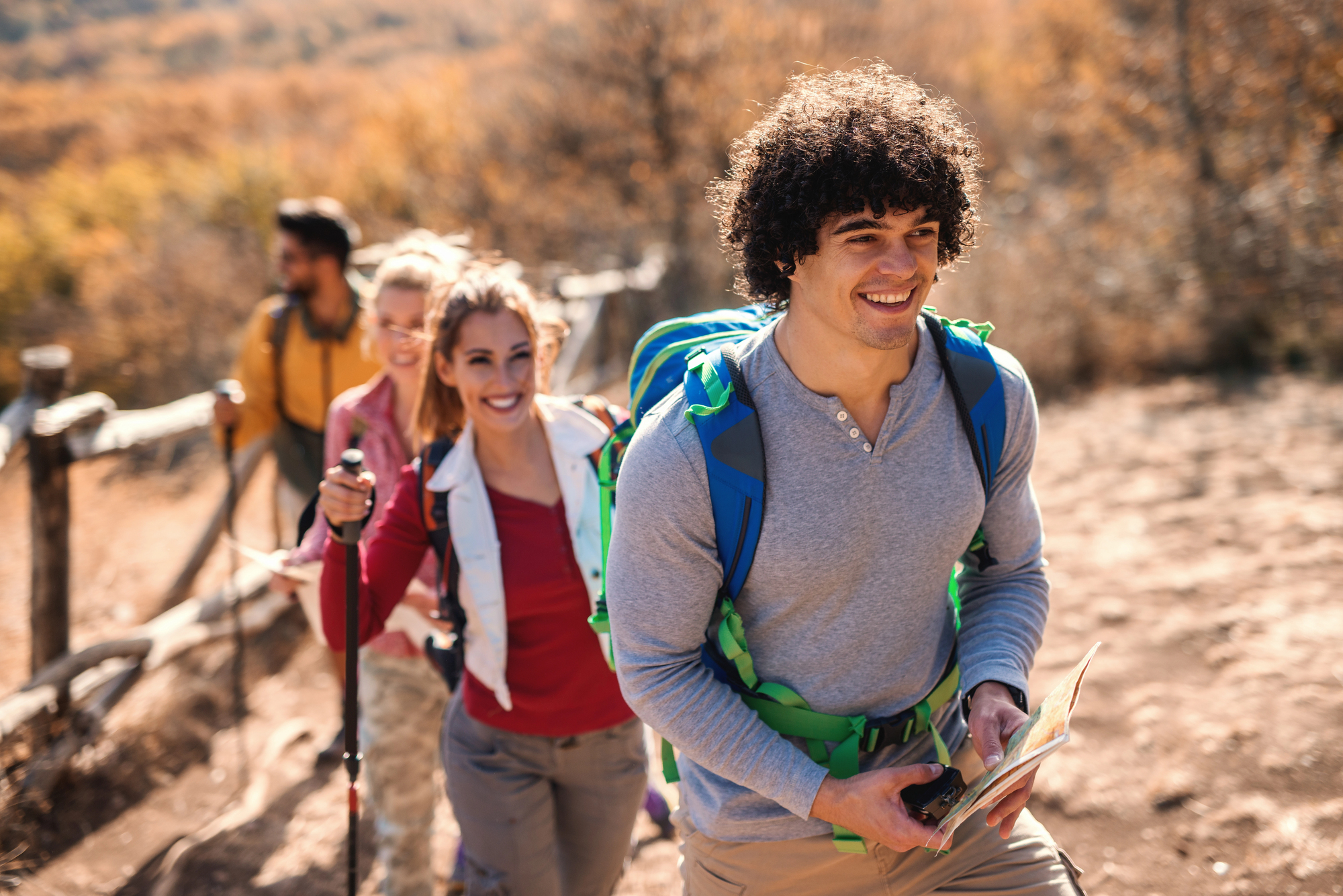 Group of hikers enjoying an outdoor trail, symbolizing well-being and an active lifestyle supported by PacificSource therapy coverage through experiential treatment