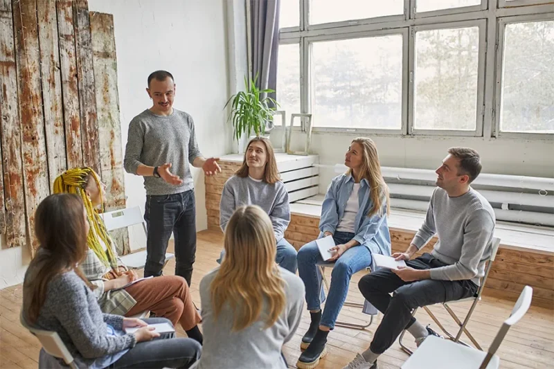 individuals struggling with excessive alcohol use are undergoing group therapy for substance abuse.