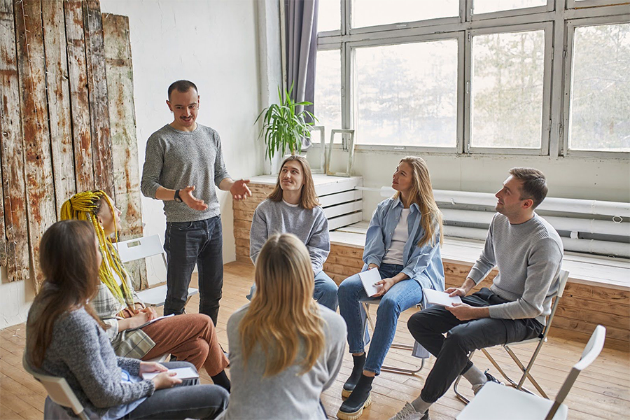 Individuals struggling with excessive alcohol use are undergoing group therapy for substance abuse.