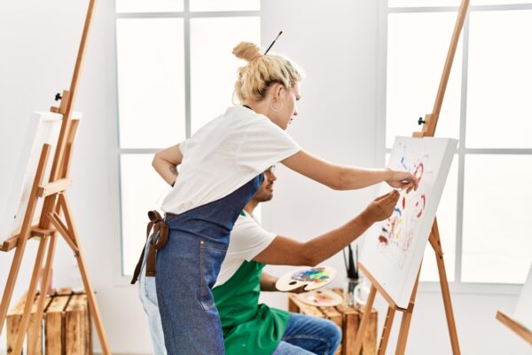 Licensed art therapist at BIG SKY Treatment guiding participant in a painting session, focusing on emotional exploration and creative expression