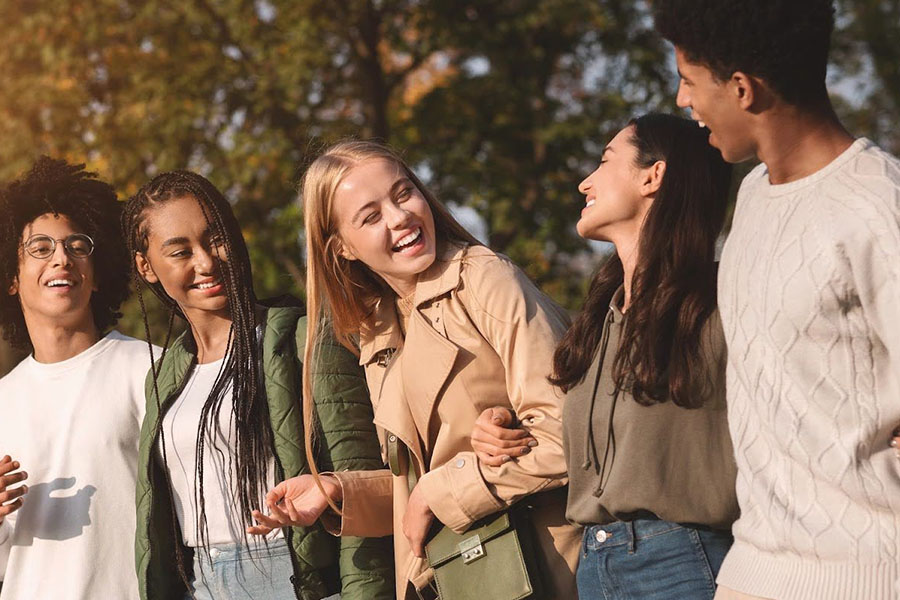 young adults walking together outdoors, highlighting awareness of fentanyl addiction and the importance of community support