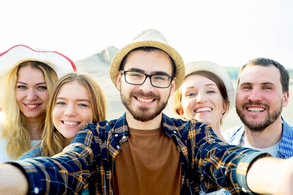 group of friends taking a selfie, enjoying life in a methamphetamine recovery program