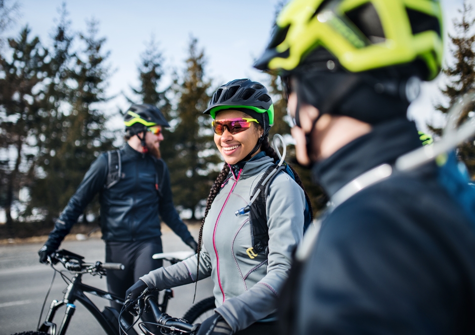 Group of individuals biking together, enjoying the camaraderie of Outpatient Support Groups