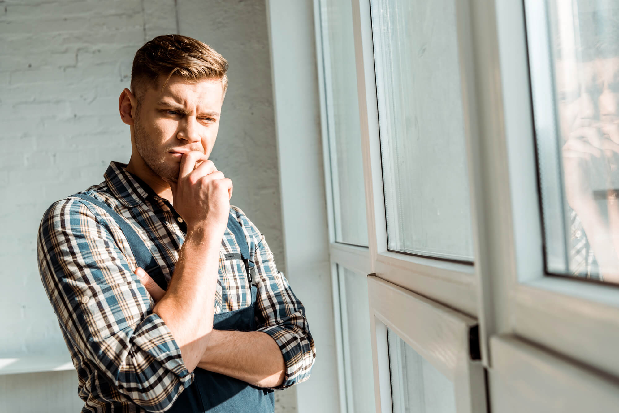 Mental Health Treatment For Sexual Addiction man looking out window thinking about sex addiction