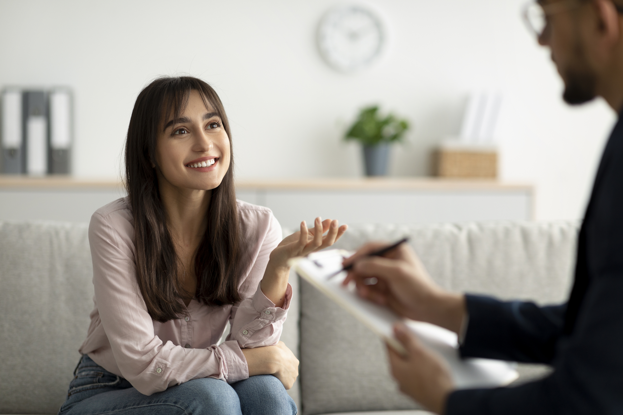 Female client having consultation with psychologist, grateful for professional help and her BCBSMT mental health coverage.