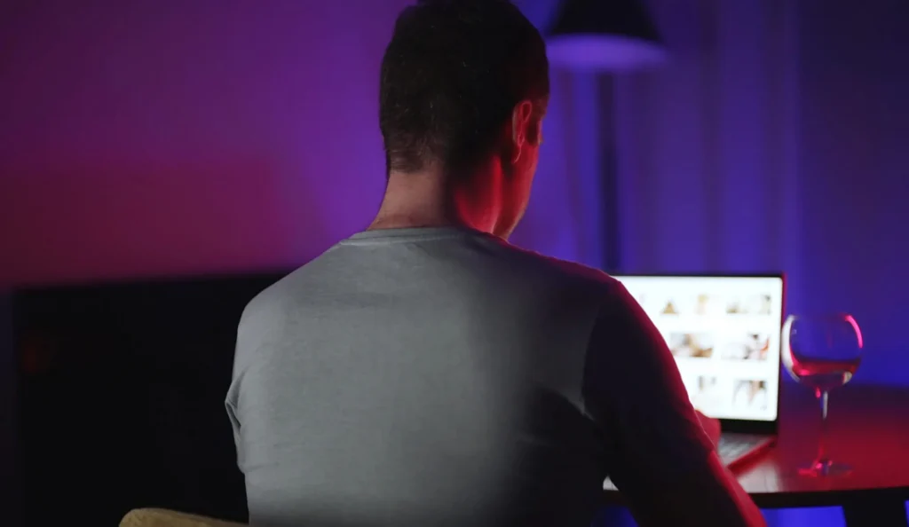 man secretly watching porn at night