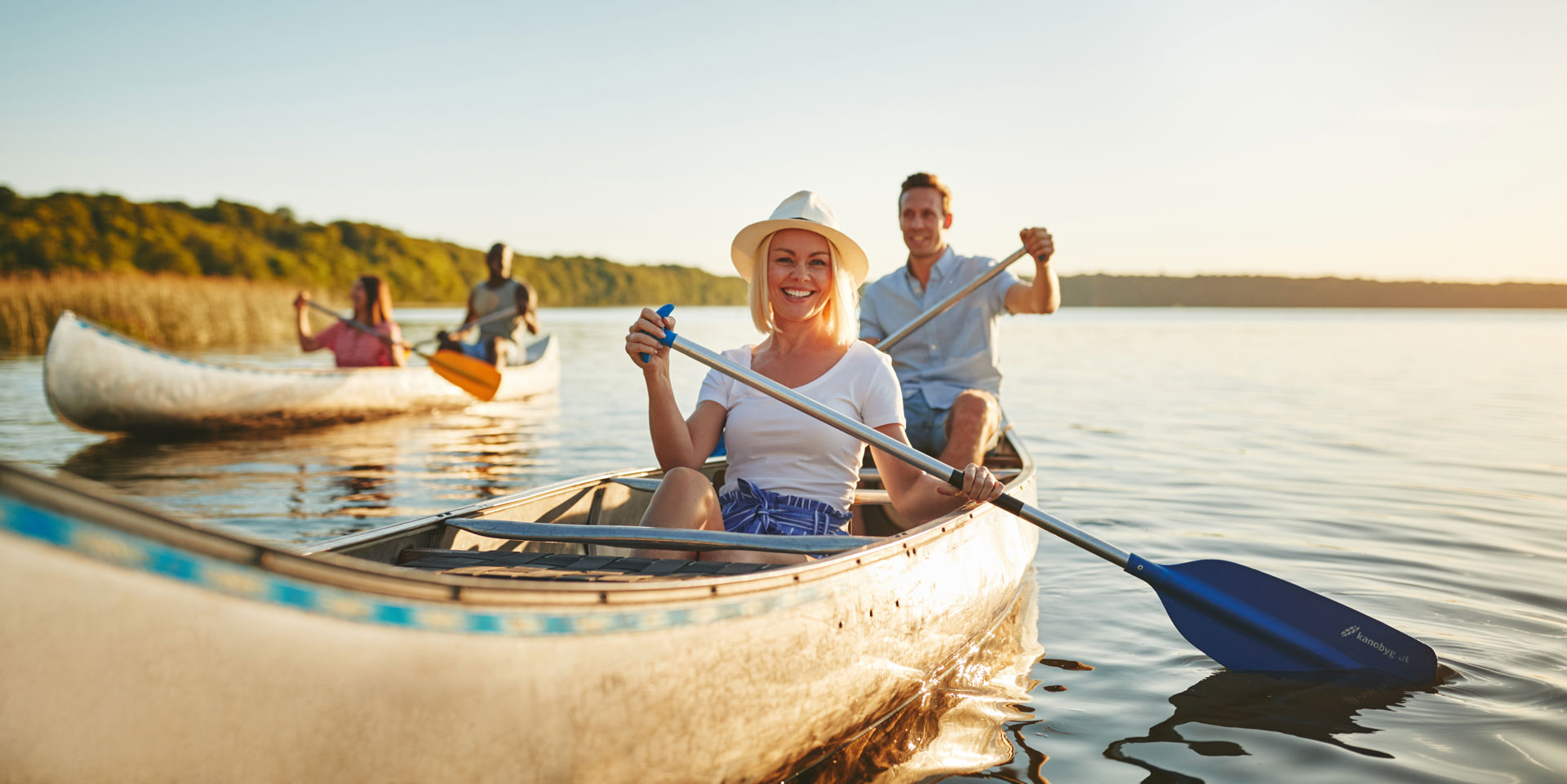 Couple canoeing together, enjoying nature as a form of stress disorder treatment Couple canoeing together, enjoying nature as a form of stress disorder treatment