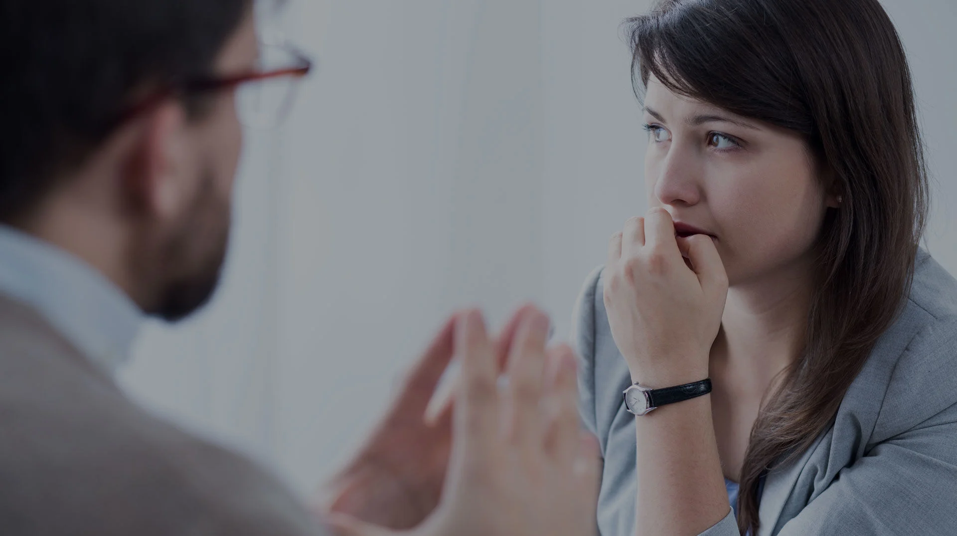 Concerned Woman In A Counseling Session, Potentially Engaging In An Anxiety Management Discussion. concerned woman in a counseling session, potentially engaging in an anxiety treatment program.