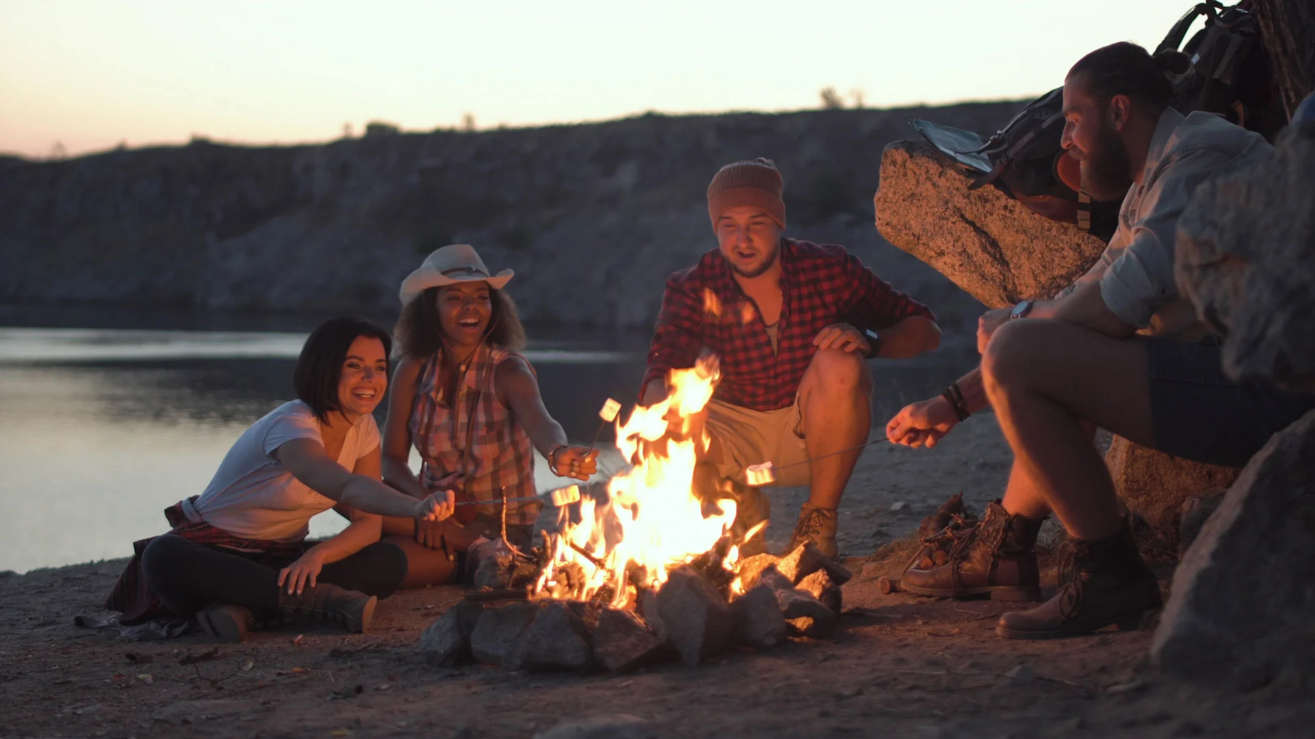 friends enjoying a campfire as part of an outpatient rehabilitation program