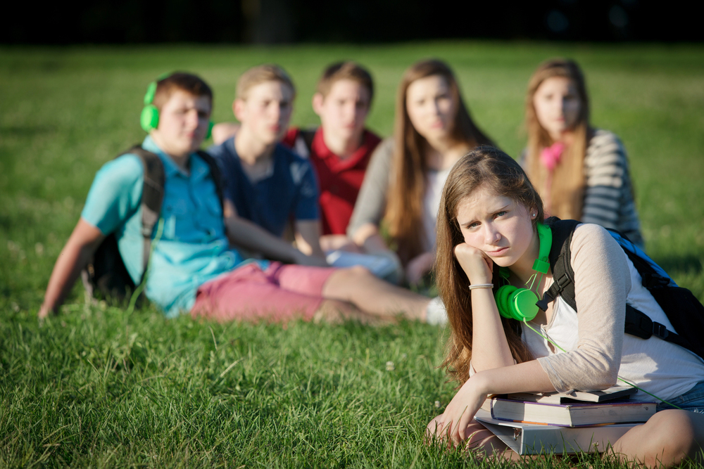Teens peer pressuring a girl in Montana to do drugs with them