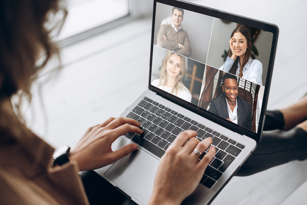 A patient listening attentively during her online group therapy session.