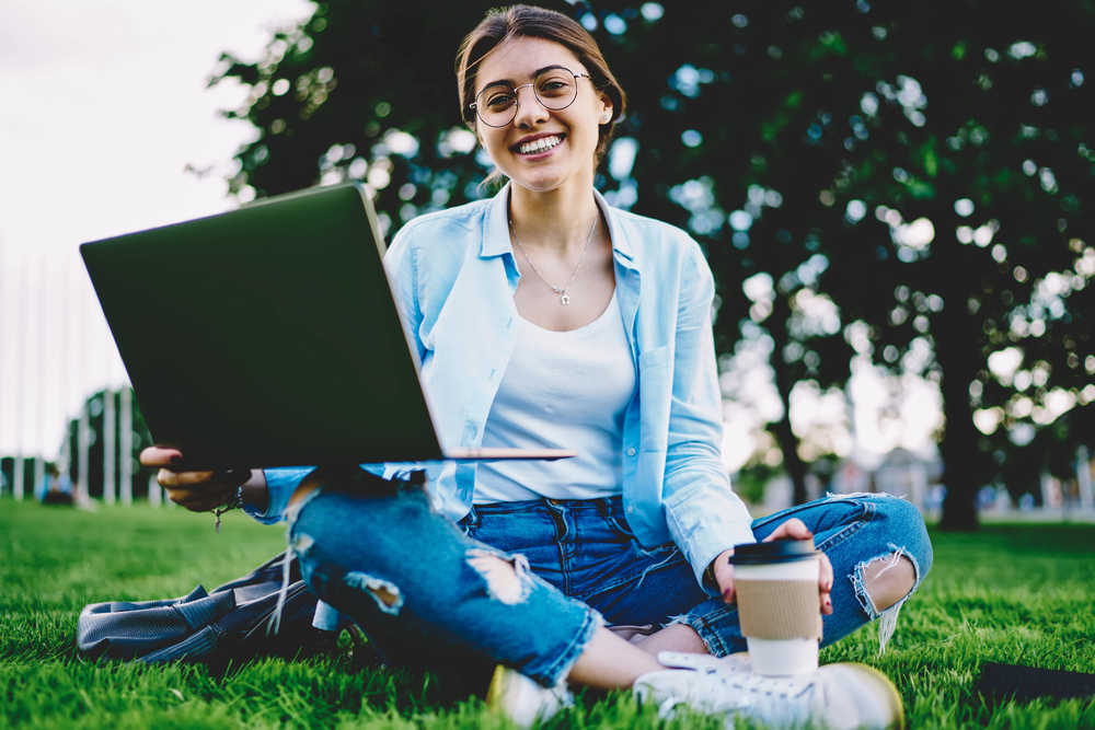 Virtual vs. In-Person Addiction Treatment - female Virtual IOP outside in a park