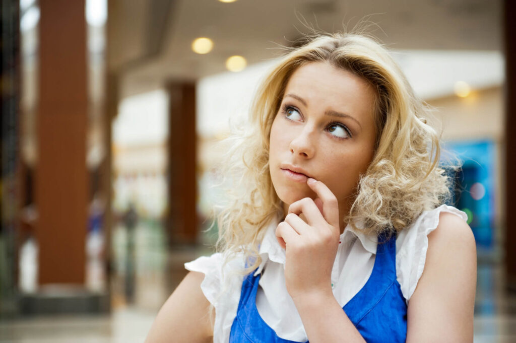 woman thinking about her sexual urges A Kratom addiction support group meeting with six people seated in a circle, discussing and offering support.
